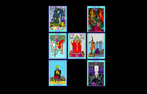 Three tarot cards laid out on a dark wooden table by candlelight for a Lion's Gate reading